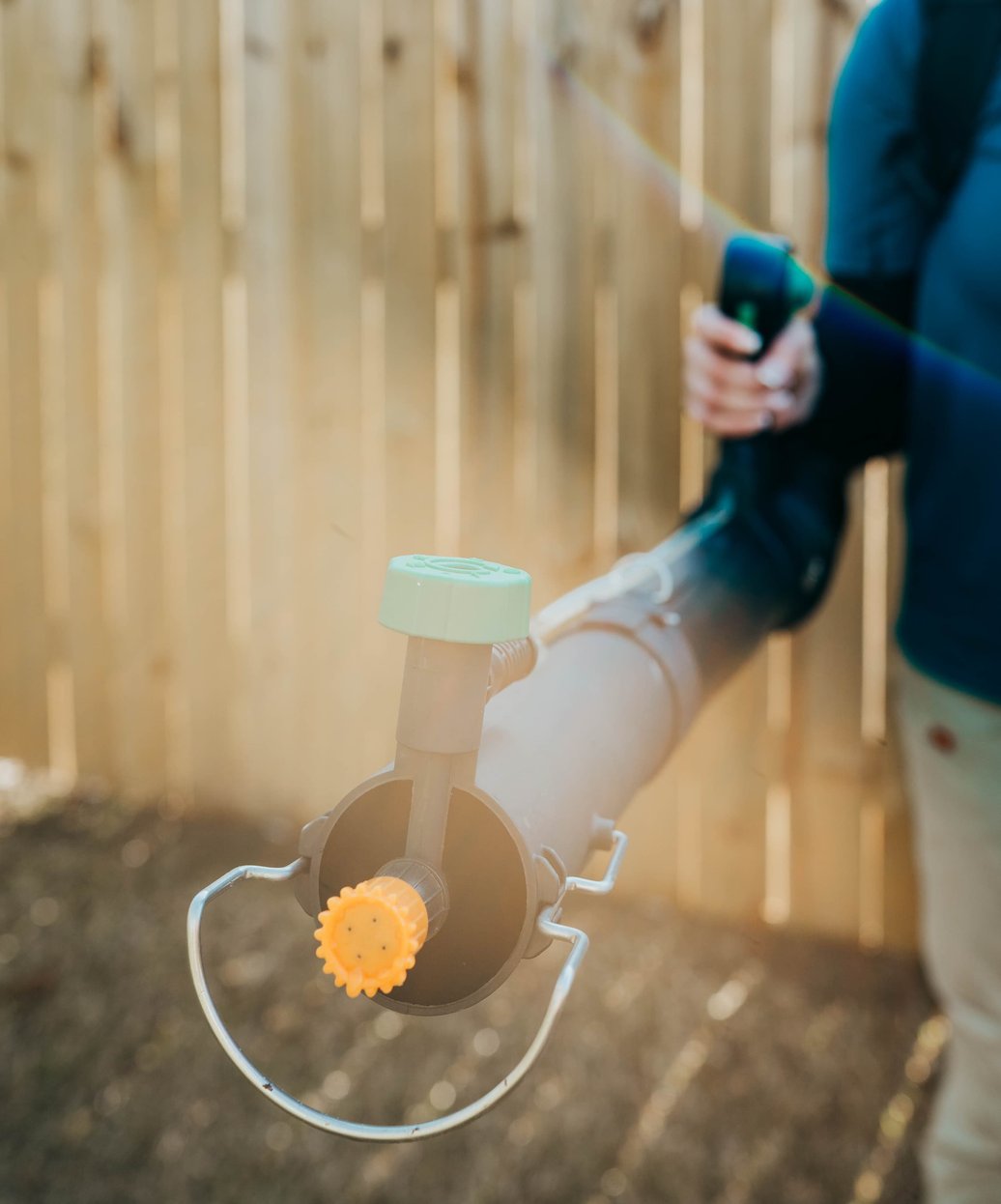 Pest control technician treating wall cavity