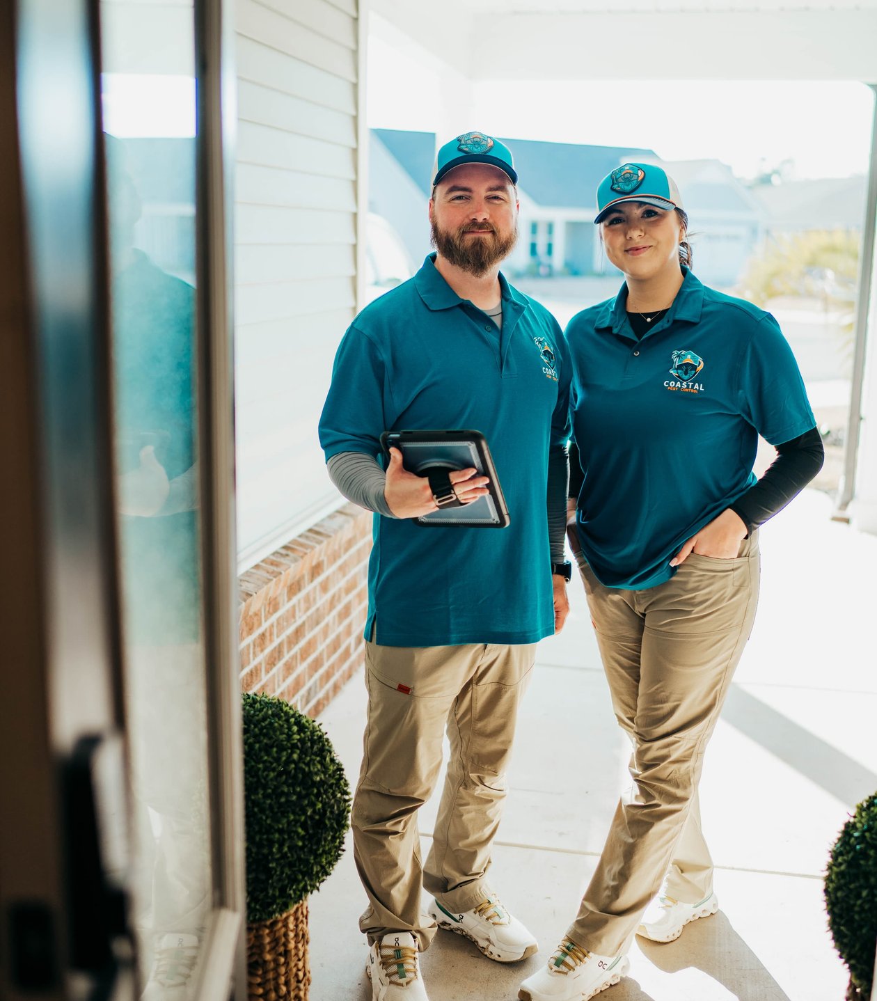 Pest control technicians preparing treatment